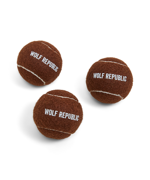 set of three brown tennis balls with logo